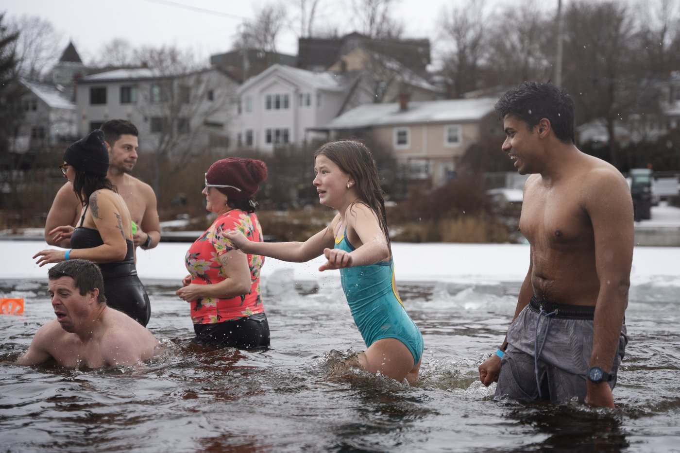 Many mark the new year with 'exhilarating' polar dip in icy water | iNFOnews.ca