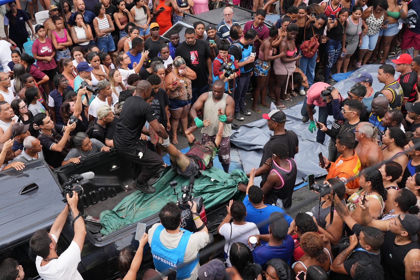 Anguish in Rio: Photos show bodies lining the streets after massive police raid | iNFOnews.ca