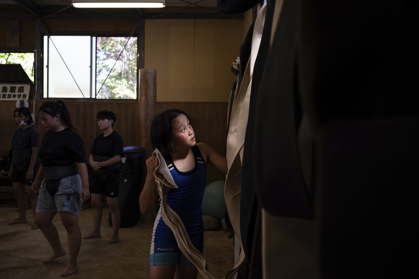 Photos show women in Japan working to break down barriers in ancient, tradition-bound sumo | iNFOnews.ca