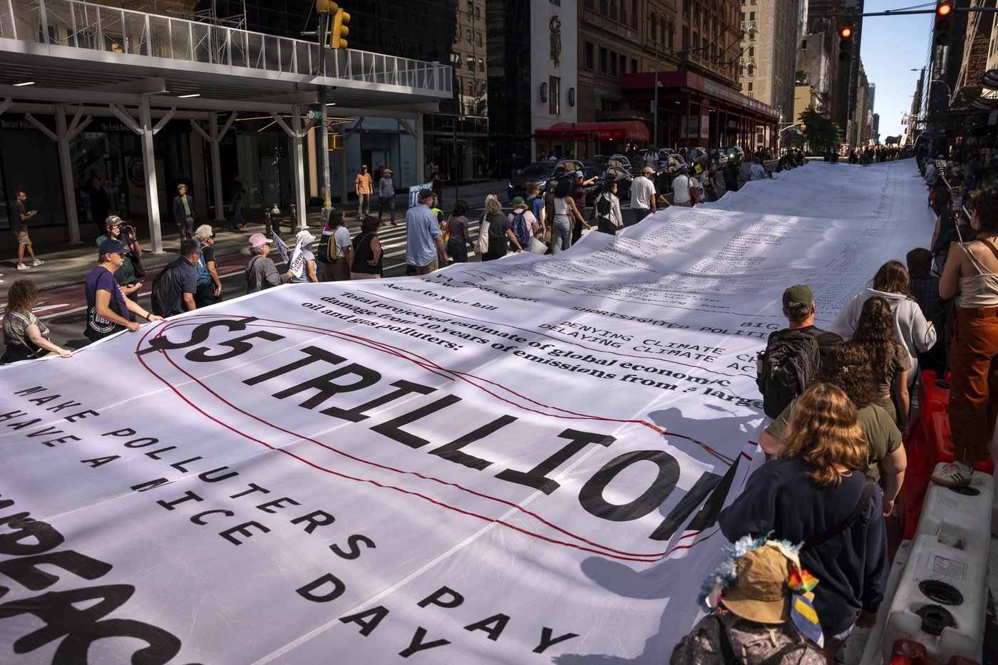 Photos show activists targeting billionaires in a street protest on the eve of New York Climate Week | iNFOnews.ca