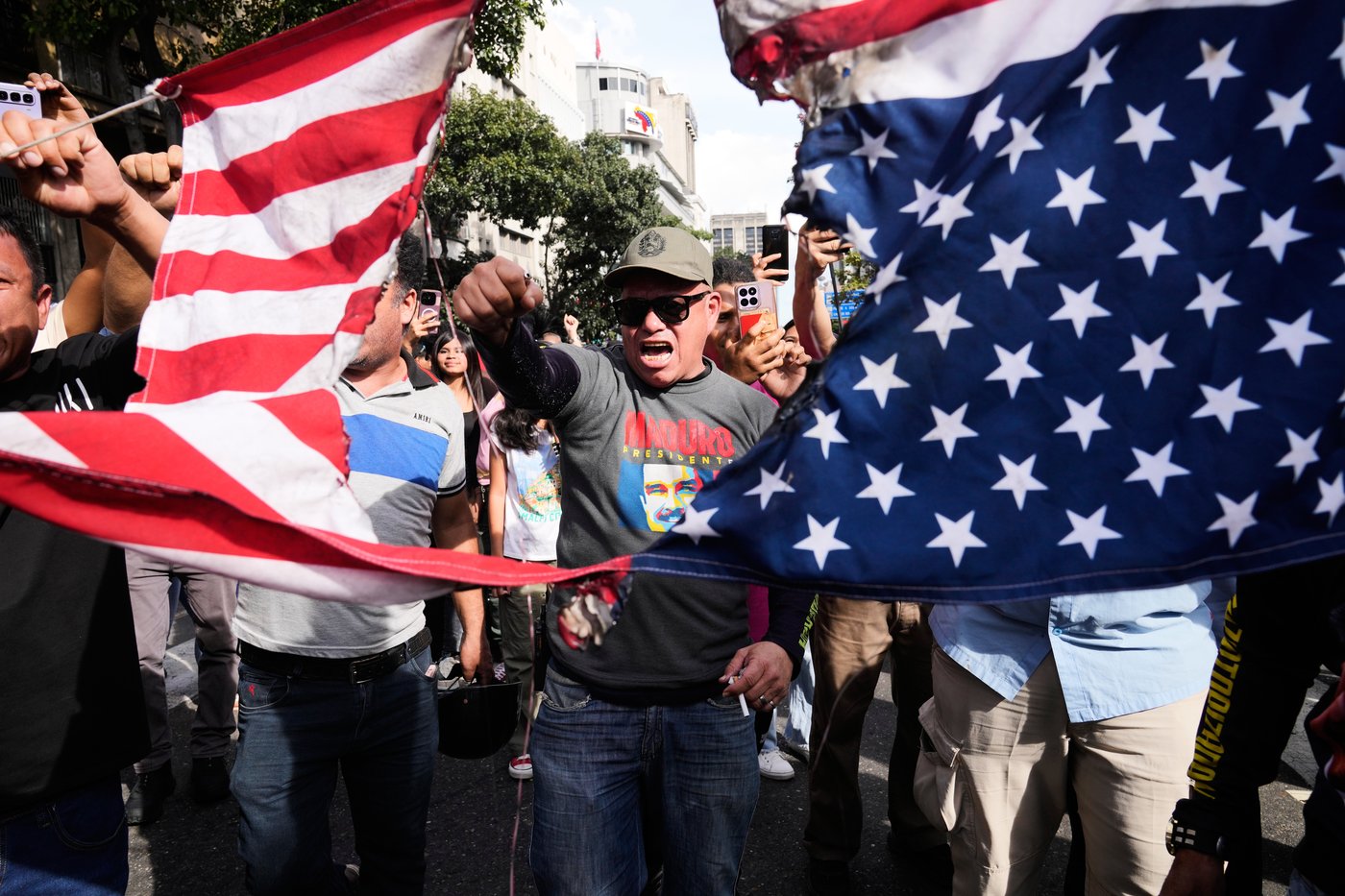 Photos show people reacting to the US capture of Venezuelan President Nicolas Maduro | iNFOnews.ca