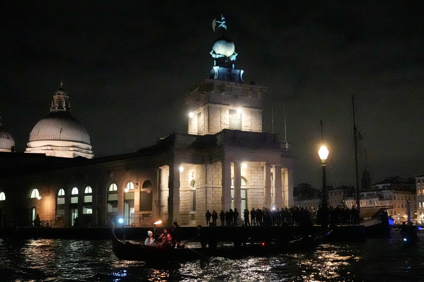 Olympic flame glides on traditional Venetian boats down the Grand Canal | iNFOnews.ca