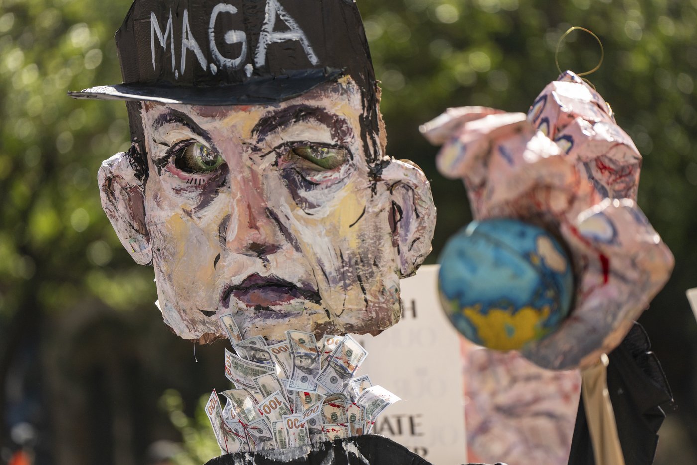 Photos show activists targeting billionaires in a street protest on the eve of New York Climate Week | iNFOnews.ca