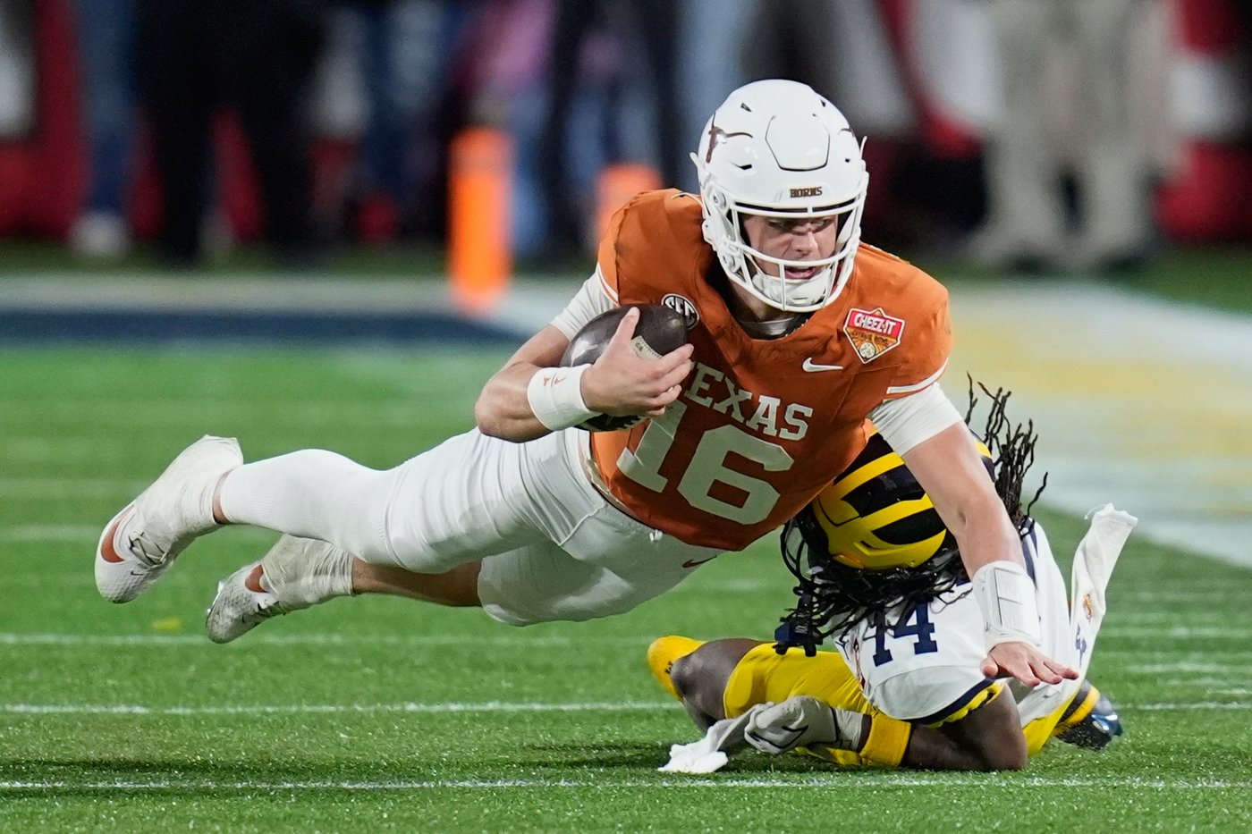 Arch Manning runs and passes Texas past Michigan in Citrus Bowl | iNFOnews.ca
