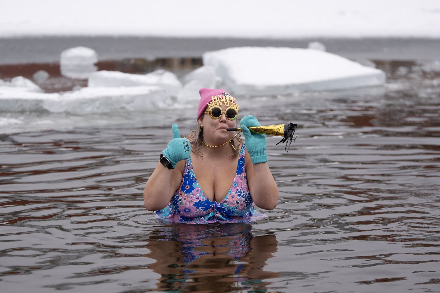 Many mark the new year with 'exhilarating' polar dip in icy water | iNFOnews.ca